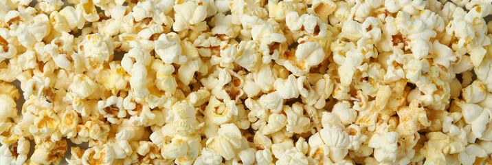 Tasty popcorn all over background, close up