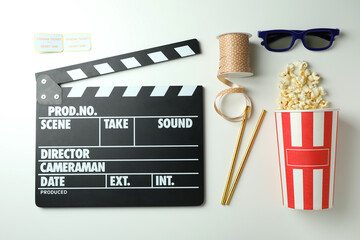 Concept of cinema accessories on light background