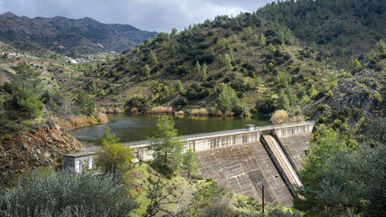 Fototapeta na wymiar Water storage in Cyprus, Palaichori dam in Troodos mountains