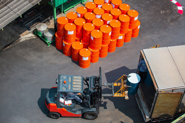 Oil barrels forklift truck move for on the transportation truck © chitsanupong