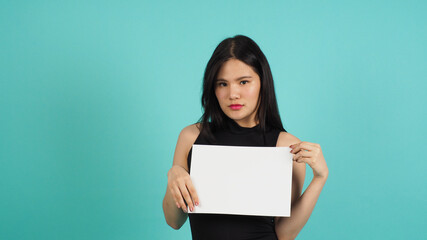 Blank empty paper in asian woman's hand on mint green or Tiffany Blue background.