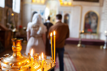 Traditional christening in church with candles