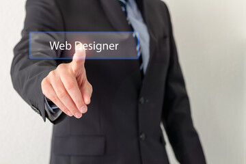 A Businessman is pressing a virtual button with the word Web Designer