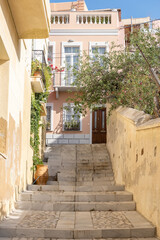 Syros island Cyclades Hermoupolis village building stairs at capital destination Greece. Vertical