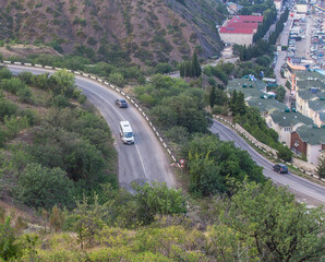 Mountain winding road in the mountains near the village.