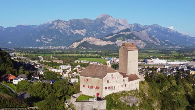 Aerial drone footage of the Sargans village and medieval hilltop fortress in Canton Sankt Gallen in eastern Switzerland. Shot with a rotation motion. 