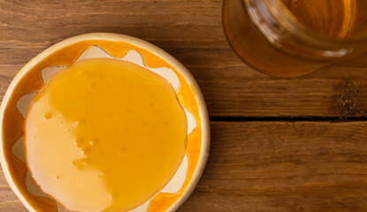 Honey on wood background