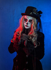 Beautiful woman with scary Halloween make up dead day calavera style