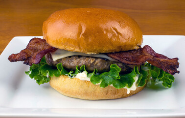 swiss bacon burger  on a brioche