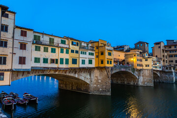 Fototapeta na wymiar Sunset on Ponte Vecchio - Old Bridge - in Florence, Italy. Amazing blue light before the evening.