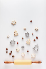 Christmas composition is made of Christmas cookies, cookie cutters, nuts, anice stars and rolling...