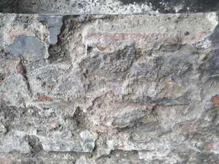 Grungy weathered wall with rough texture for background or wallpaper
