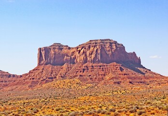 Large Rock Outcropping In Early Morning Rising Up High Desert Floor