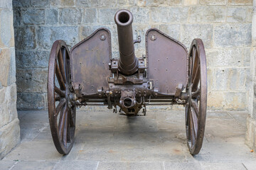 Fototapeta na wymiar Fortification, Military cannon in the fortified citadel of Pamplona, ​​Navarra Spain. Piece of artillery from the 19th century made of steel and used in the Carlist wars