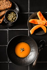 pumpkin soup on a black background