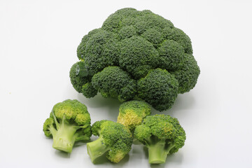 Cut broccoli isolated on white background