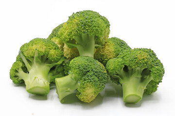 Cut broccoli isolated on white background