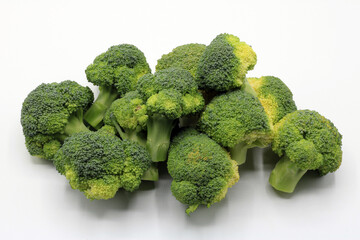 Cut broccoli isolated on white background
