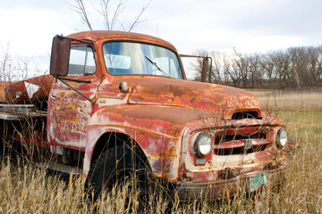 Old rusting forgotten truck stands in farmers field Ottertail Minnesota MN USA