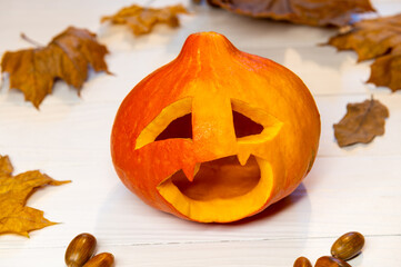 Lantern with pumpkin head for Halloween, with leaves on white