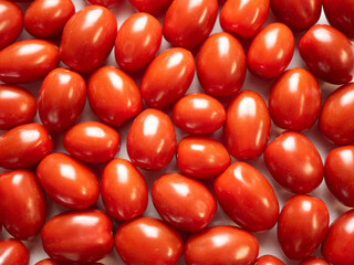 Pigeon heart cherry tomatoes, background. Flat lay, top view.