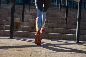 Fototapeta na wymiar Back close up of active woman workout outdoors