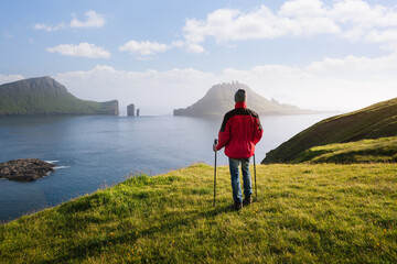 Fototapeta na wymiar The view of the Drangarnir sea stacks and the Tindholmur islet, Faroe Islands