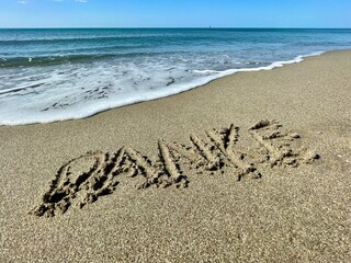 inscription on the sand Thank you-Danke