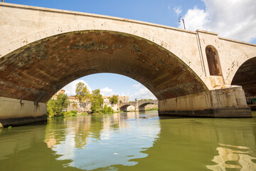 Fototapeta premium Boat ride on the Tiber in Rome.On the river to sail