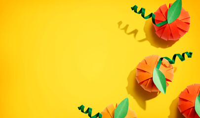 Paper craft autumn pumpkins overhead view - flat lay