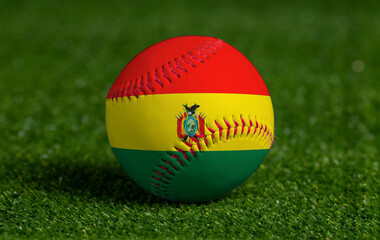 Baseball with Bolivia flag on green grass background, close up