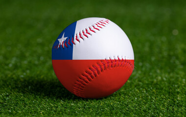 Baseball with Chile flag on green grass background, close up