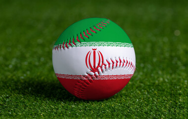 Baseball with Iran flag on green grass background, close up