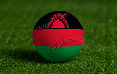 Baseball with Malawi flag on green grass background, close up