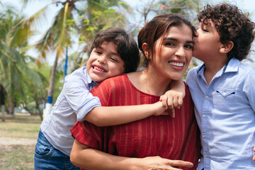 Obraz premium A young mother and her children