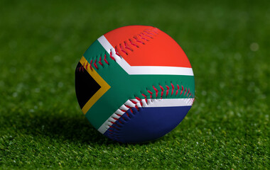 Fototapeta na wymiar Baseball with South Africa flag on green grass background, close up