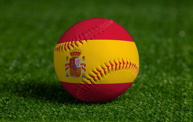 Baseball with Spain flag on green grass background, close up