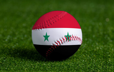 Baseball with Syria flag on green grass background, close up