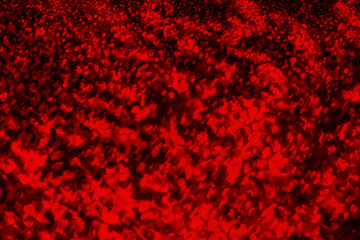Fototapeta na wymiar Dark red splatters textured surface above on a black background