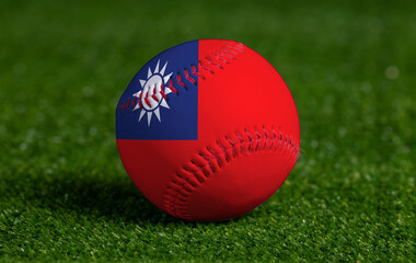 Baseball with Taiwan flag on green grass background, close up