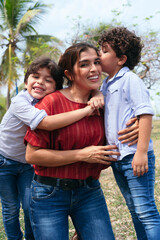 A young Hispanic mother and her children