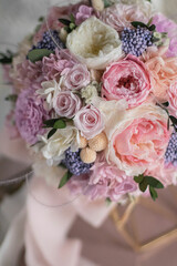 Stylish bridal bouquet of preserved flowers. Wedding bouquet of white and pink roses. Close up of wedding bouquet.