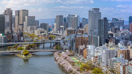 Naklejka premium Aerial view of Osaka city from sky building. Bird eye view of cityscape at Japan