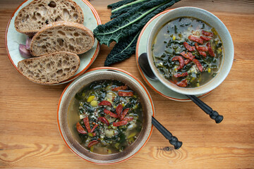 Portuguese cuisine soup with kale and chorizo sausage. Caldo verde soup.