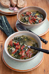 Portuguese cuisine soup with kale and chorizo sausage. Caldo verde soup.