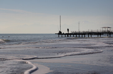 fishermen on the sea pier