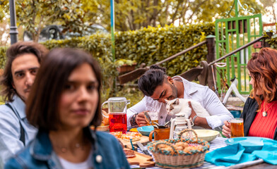 group of multi-cultural friends having fun at garden party - Young people smiling together eating food and drinking beer