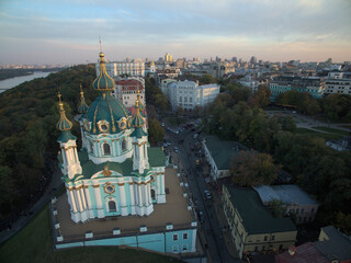 St. Andrew's Church on the descent, beautiful domes in gold, the city on the background, tourist...