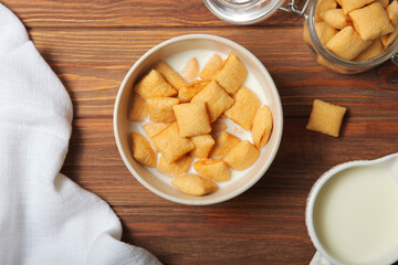 Corn pads with milk for breakfast on the table close-up