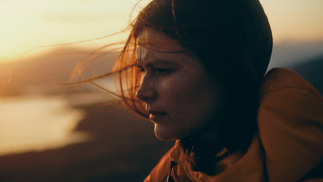 portrait of a woman at sunset in the mountains